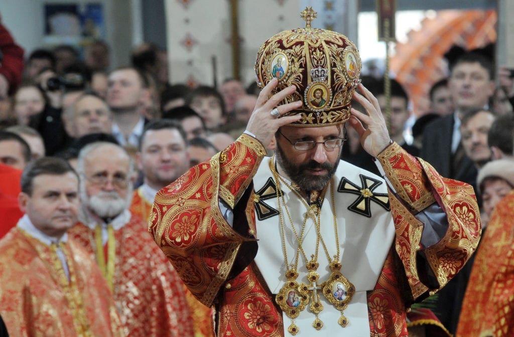 Archbishop dons the crown of his office at his enthronement ceremony.