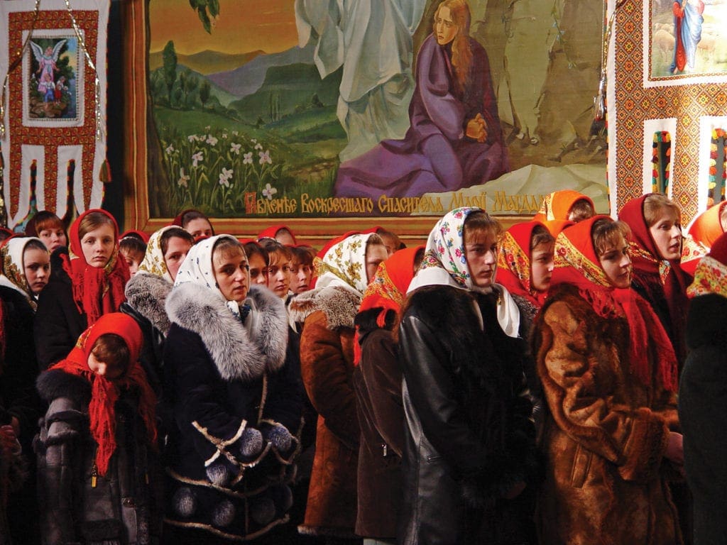 a congregation celebrates a Christmas liturgy.