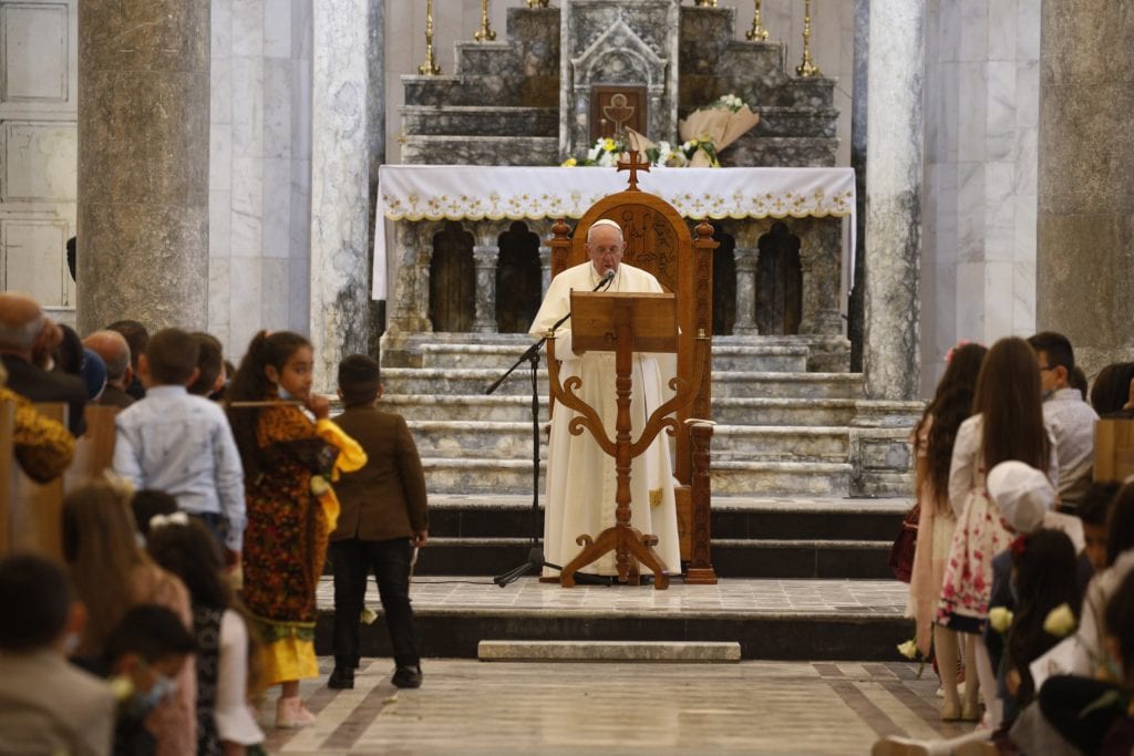 Pope Francis speaks during a meeting with the community at the Church of the Immaculate Conception in Qaraqosh, Iraq