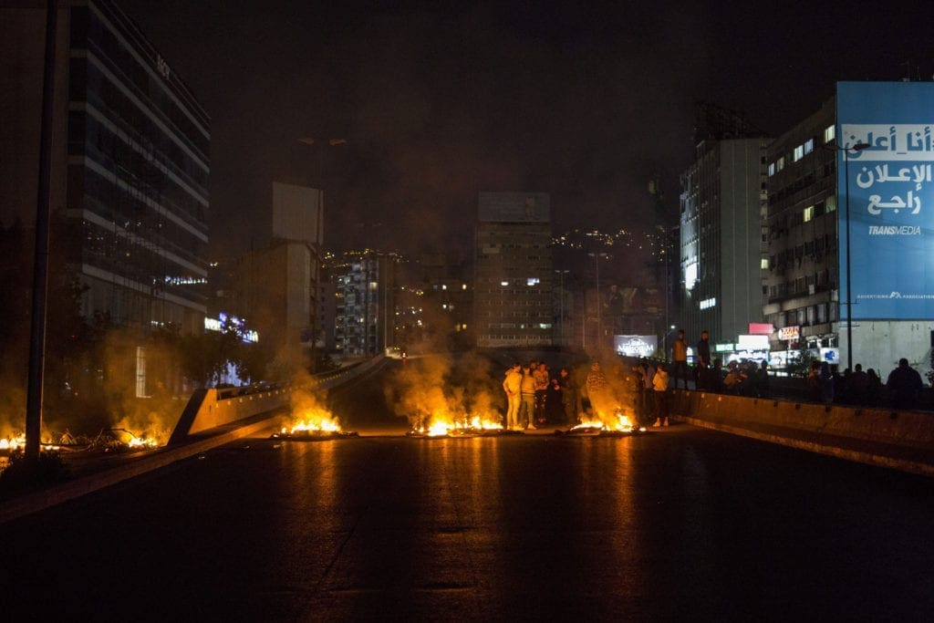 Demonstrators burn tires in early March, blocking main roads in Beirut.