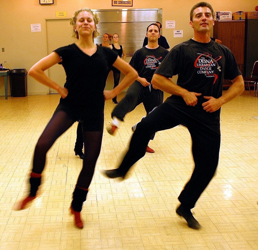 dancers rehearse a choreographed routine.