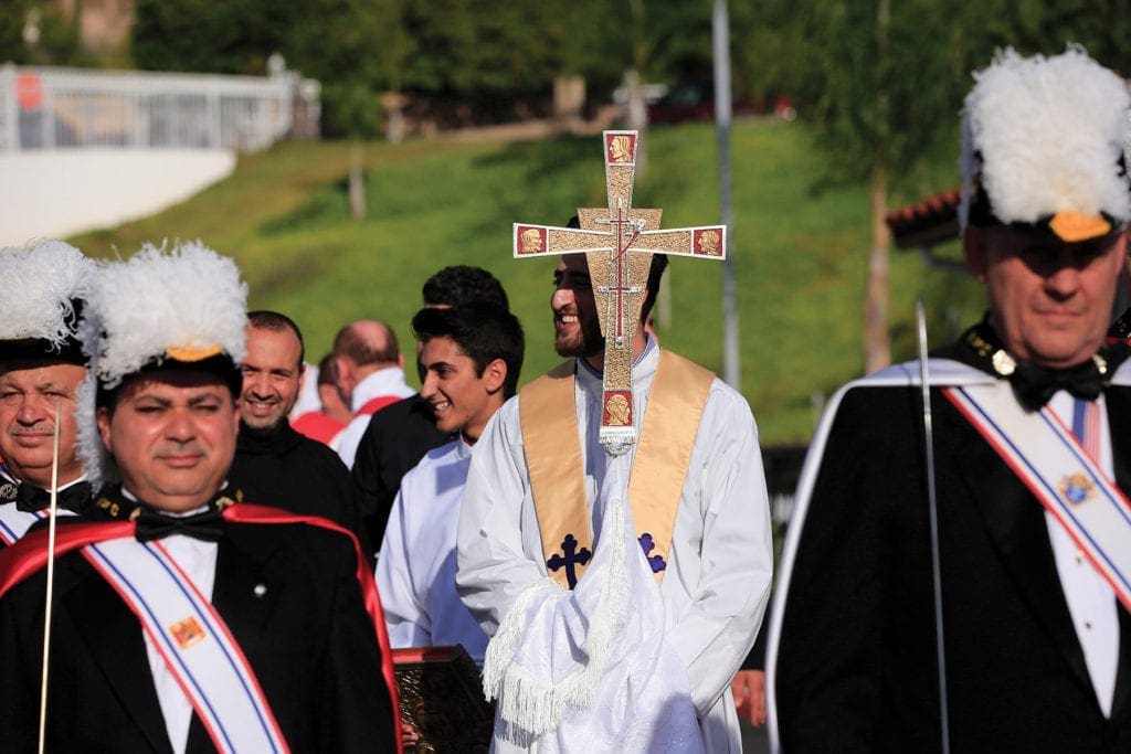 church members gather outside to attend a service.