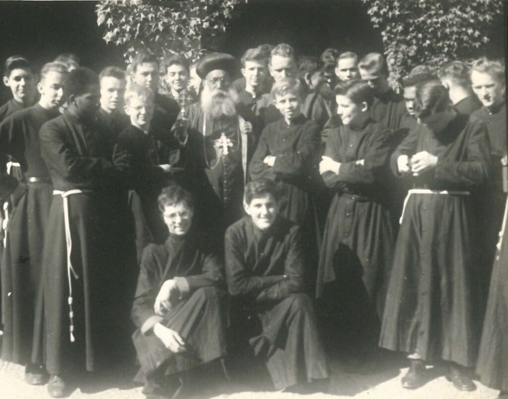 Archbishop Aboun Geervarghese Ivanios, a founding bishop of the Syro-Malankara Catholic Church in India, stands amid a group of seminarians at Graymoor, the headquarters of the Friars of the Atonement.