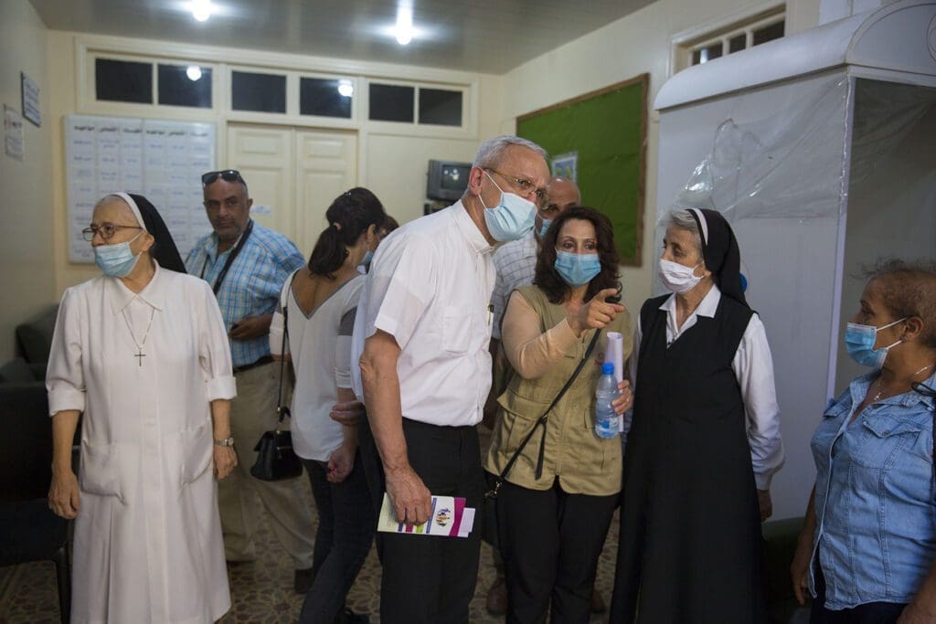 cnewa president receives a tour of a dispensary by nuns and local CNEWA staff.