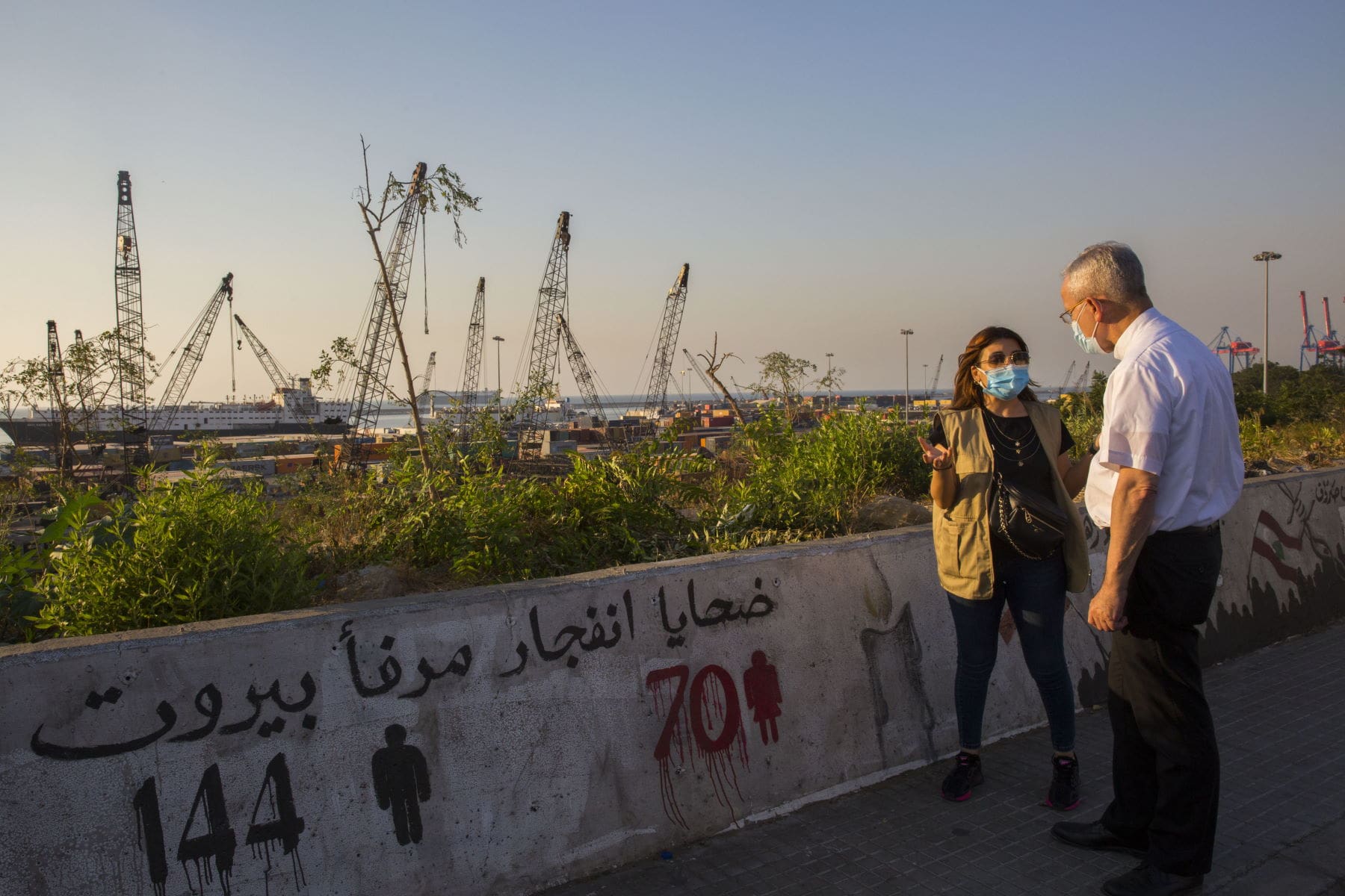 cnewa president chats with a staffer while overlooking the port of beirut. cfc support can aid cnewa's charitable activities.