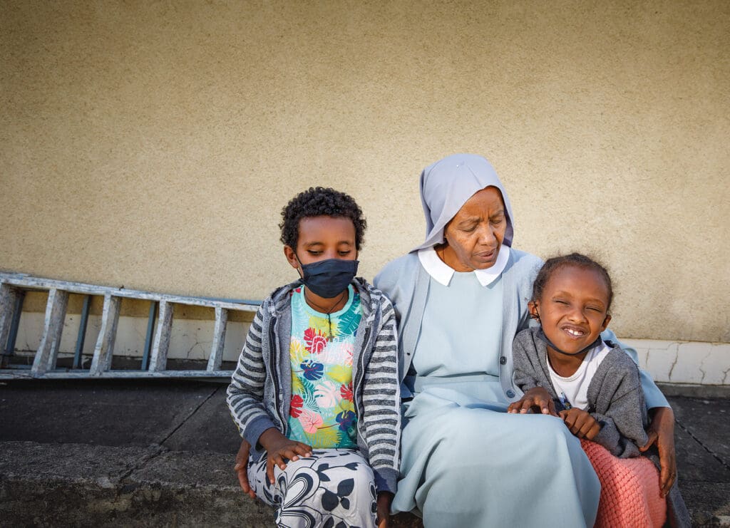 Sister Haregewein Kiflemariam sits with two St. Raphael students. (photo: Petterik Wiggers) The St Raphael Boarding School is located in the town of Azezo, in Northern Ethiopia, about 25km from the city of Gondar. Sister Hargewein has been working in the school for twelve years, alongside two other Daughters of Ste Anne Sisters and several school employees.