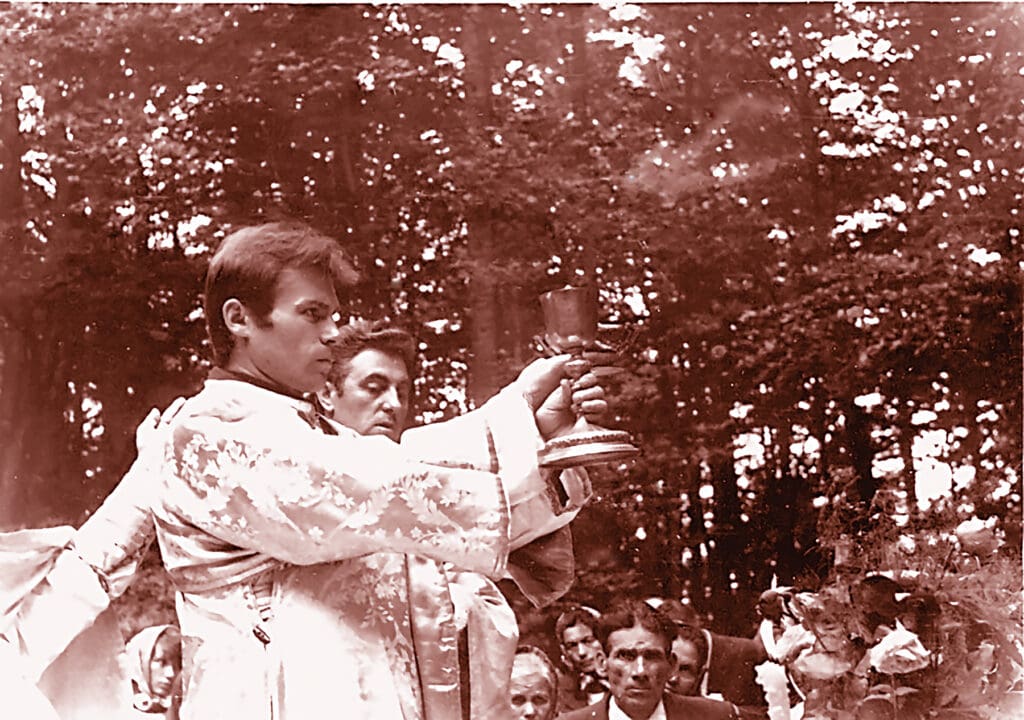 A priest of the underground Ukrainian Greek Catholic Church celebrates a Lenten liturgy in a forest in 1987