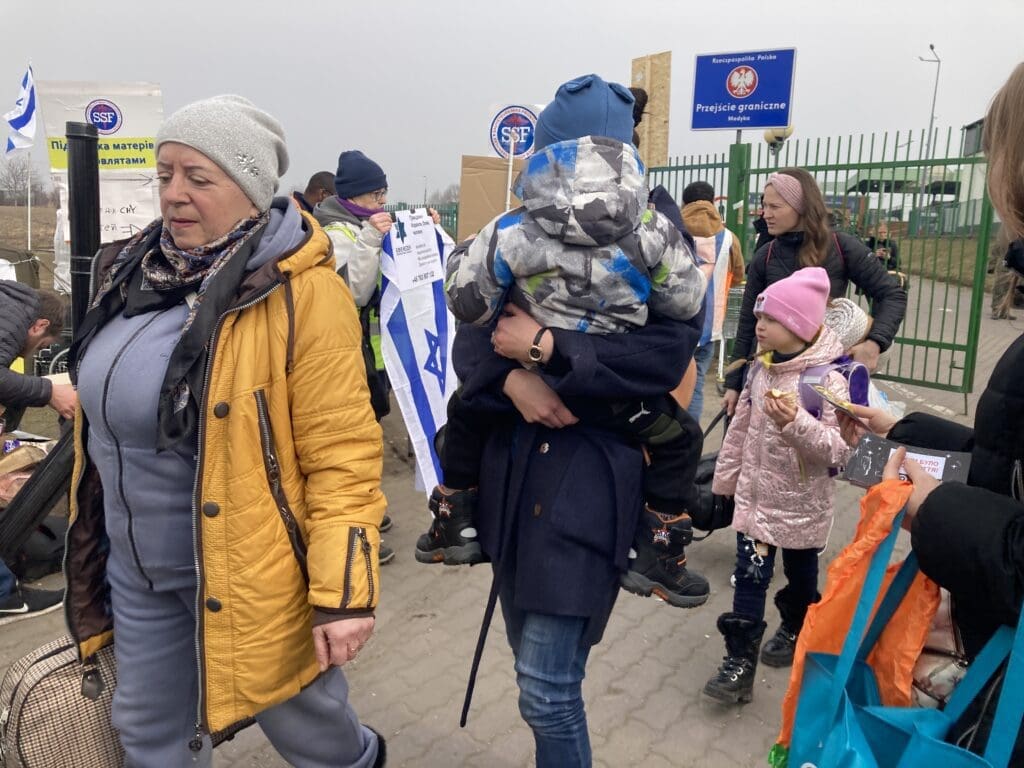 Refugees arrive at the Medyka border crossing in Poland.