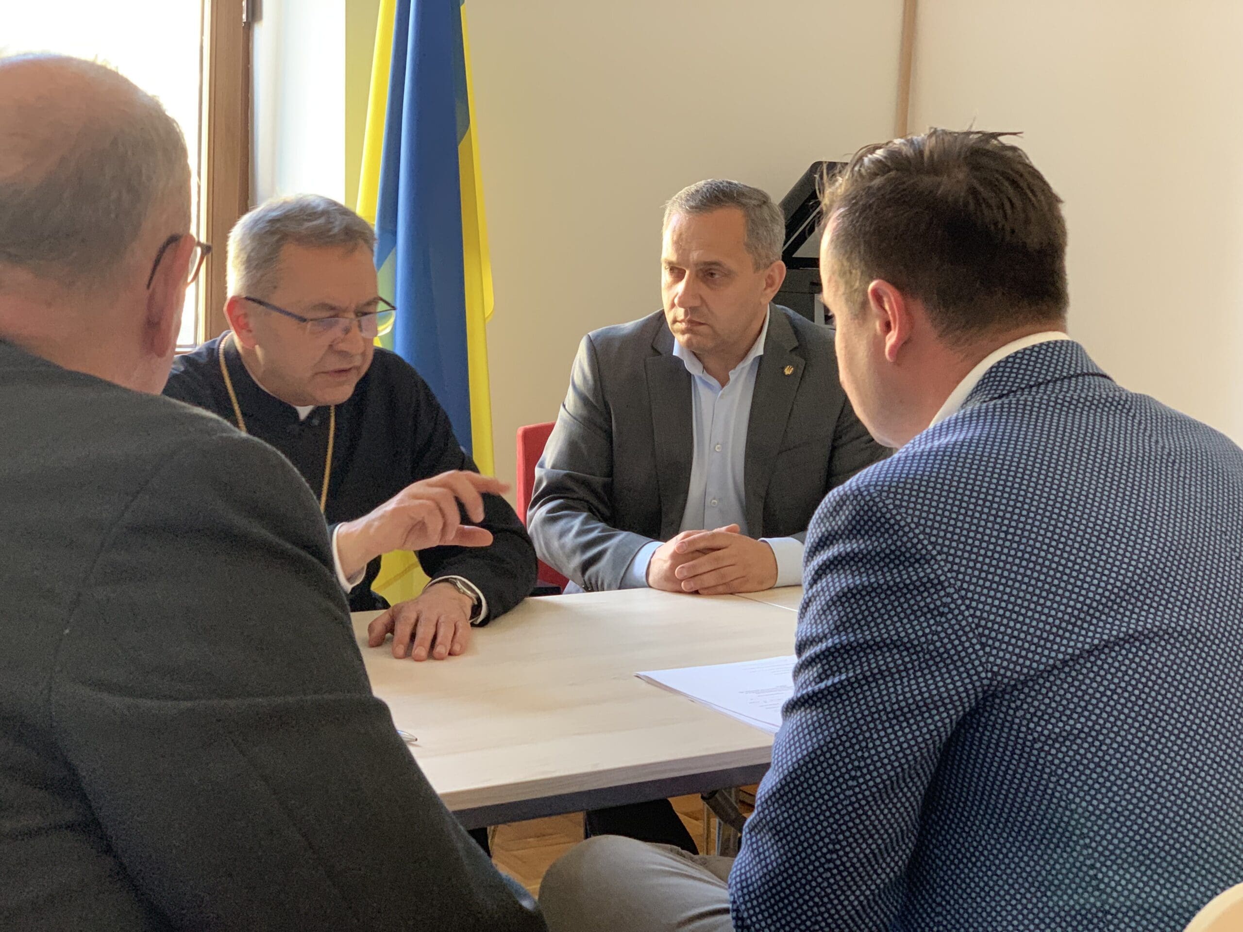 Cardinal Timothy Dolan meets with Ukrainian Greek Catholic Archbishop Eugeniusz Mirosław Popowicz of Przemysl-Warsaw (background, left) in Przemysl on 2 May. The archbishop was joined by his assistant and the Ukrainian consul.