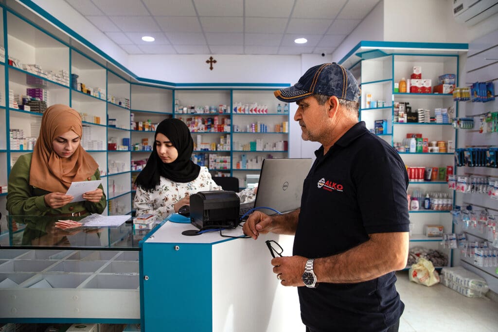 Wartikes Marderus Wartan, 55, a regular patient, picks up a prescription at the dispensary’s pharmacy.