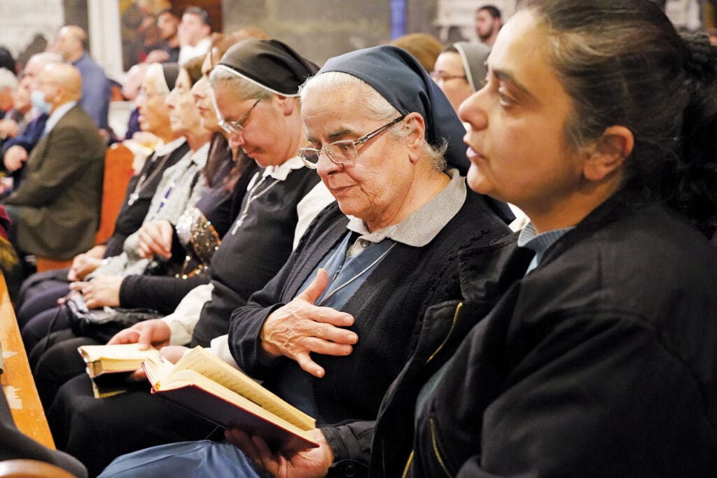Women religious attend the Holy Thursday celebration at the Melkite Greek Catholic Cathedral of Our Lady of the Dormition in Damascus with Patriarch Youssef Absi
