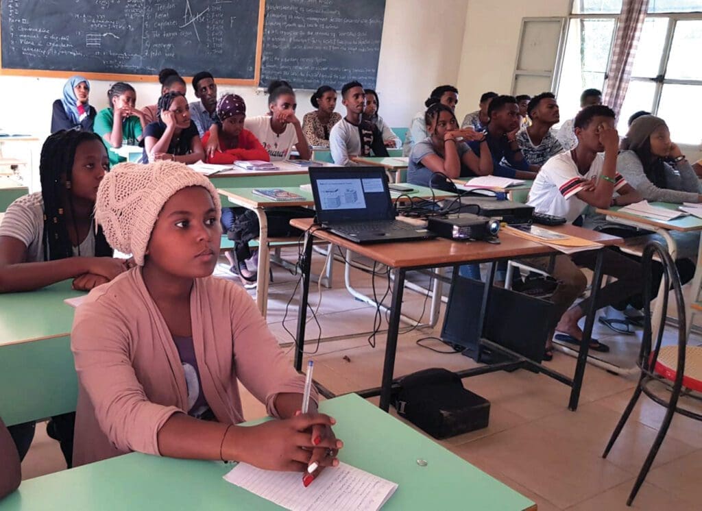 Students learn about agriculture in their indoor classrooms in Eritrea.