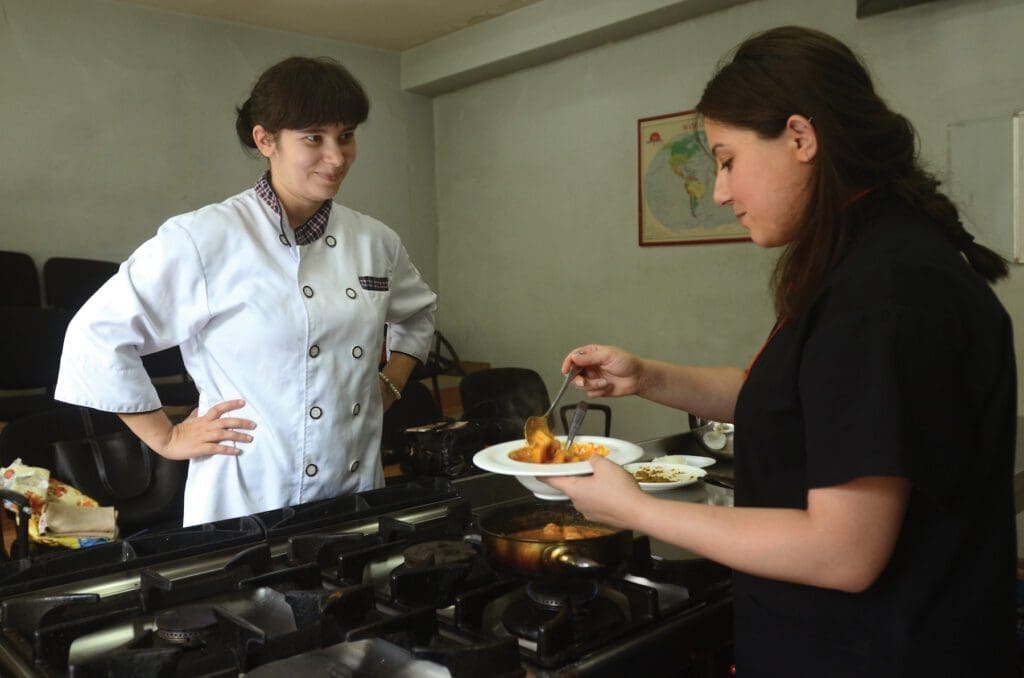 A young mother attends a culinary arts program, offered through Caritas Georgia in Tbilisi.