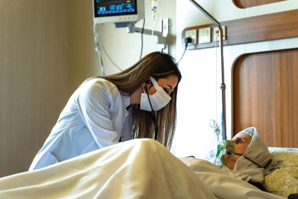 Dr. Daniella Hanna examines an elderly patient at Maryamana Hospital