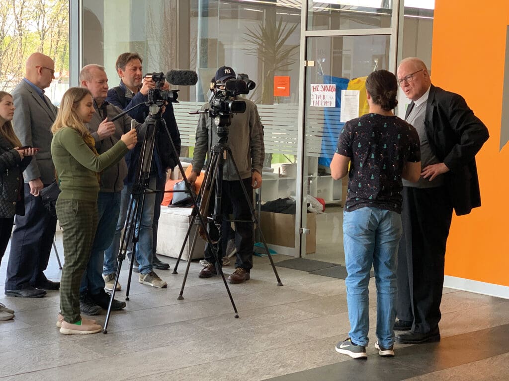 Cardinal Timothy M. Dolan interviews a student of the Ukrainian Catholic University in Lviv.